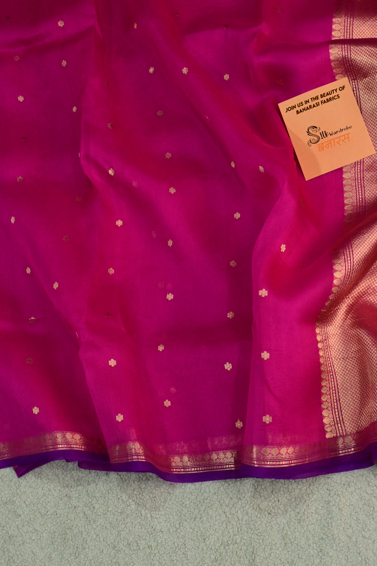 Pure Kora organza saree featuring delicate gold buttis and a contrast purple edge