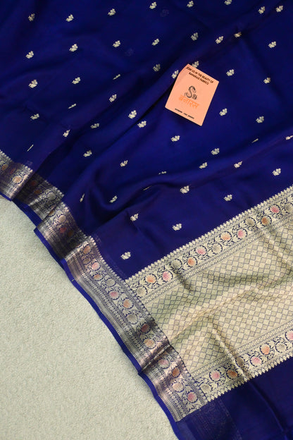 Royal blue organza saree with light gold zari weaving, handbrush work effortlessly gracefully