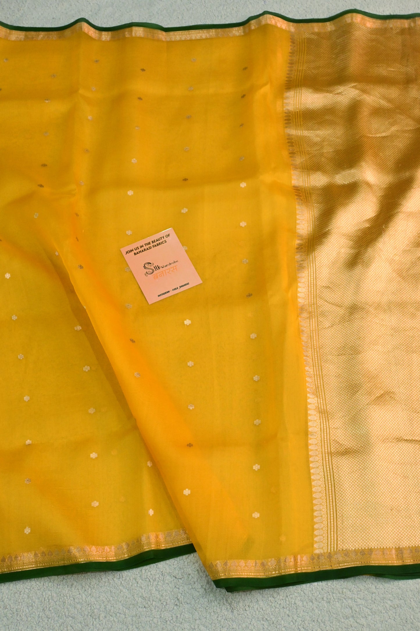 Classic yellow Kora Organza with a touch of emerald green.