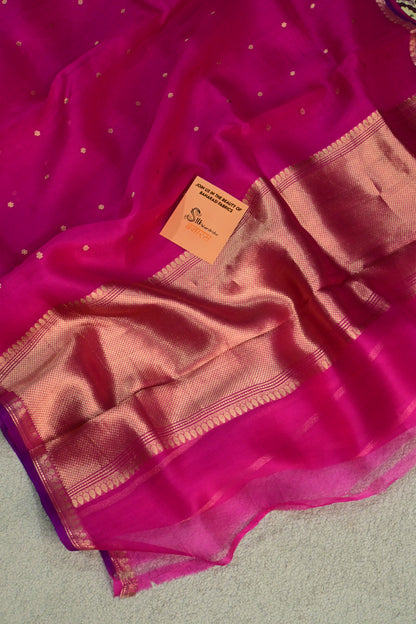 Pure Kora organza saree featuring delicate gold buttis and a contrast purple edge
