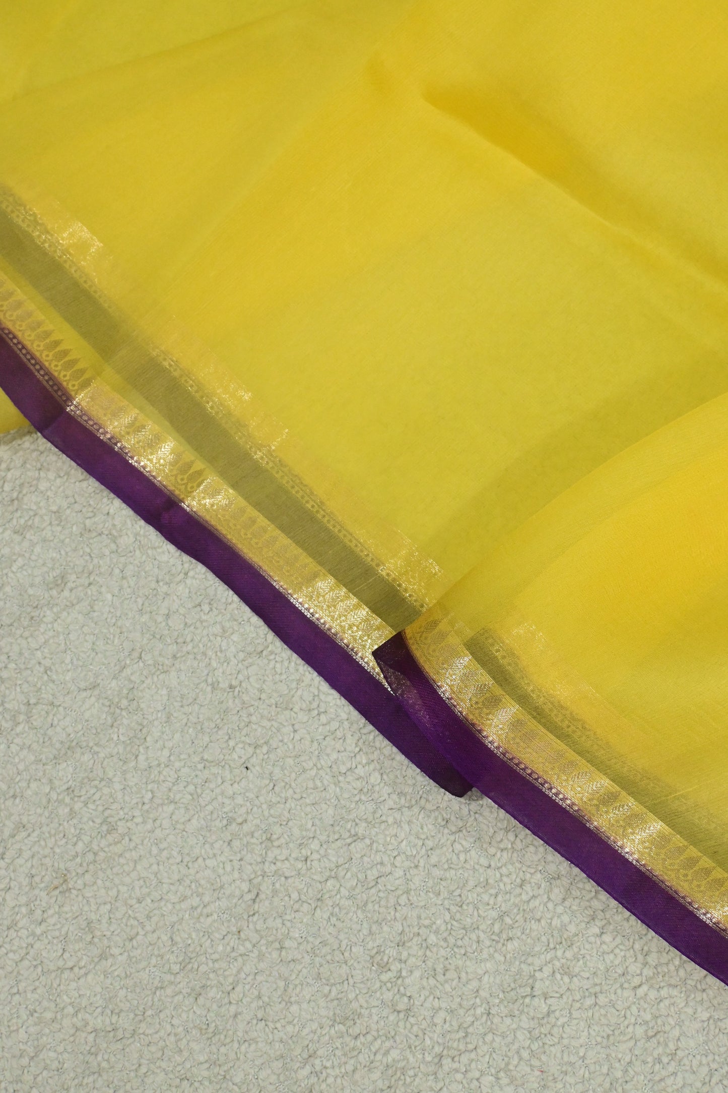 Handwoven pure Kora organza saree in contrast yellow with purple edge
