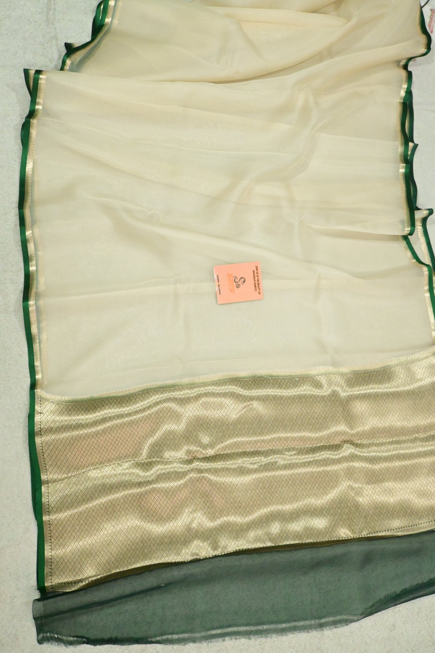 Handloom pure kora organza silk saree having satin bottlegreen selvage