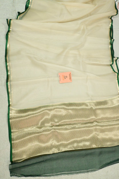 Handloom pure kora organza silk saree having satin bottlegreen selvage