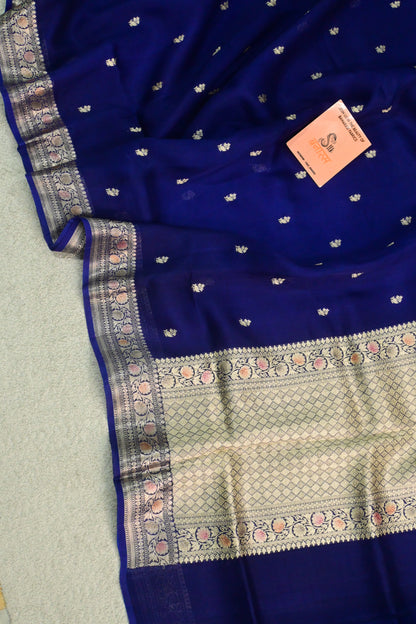 Royal blue organza saree with light gold zari weaving, handbrush work effortlessly gracefully