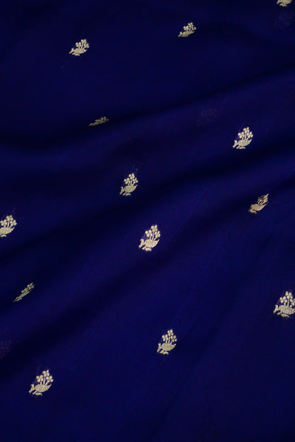 Royal blue organza saree with light gold zari weaving, handbrush work effortlessly gracefully