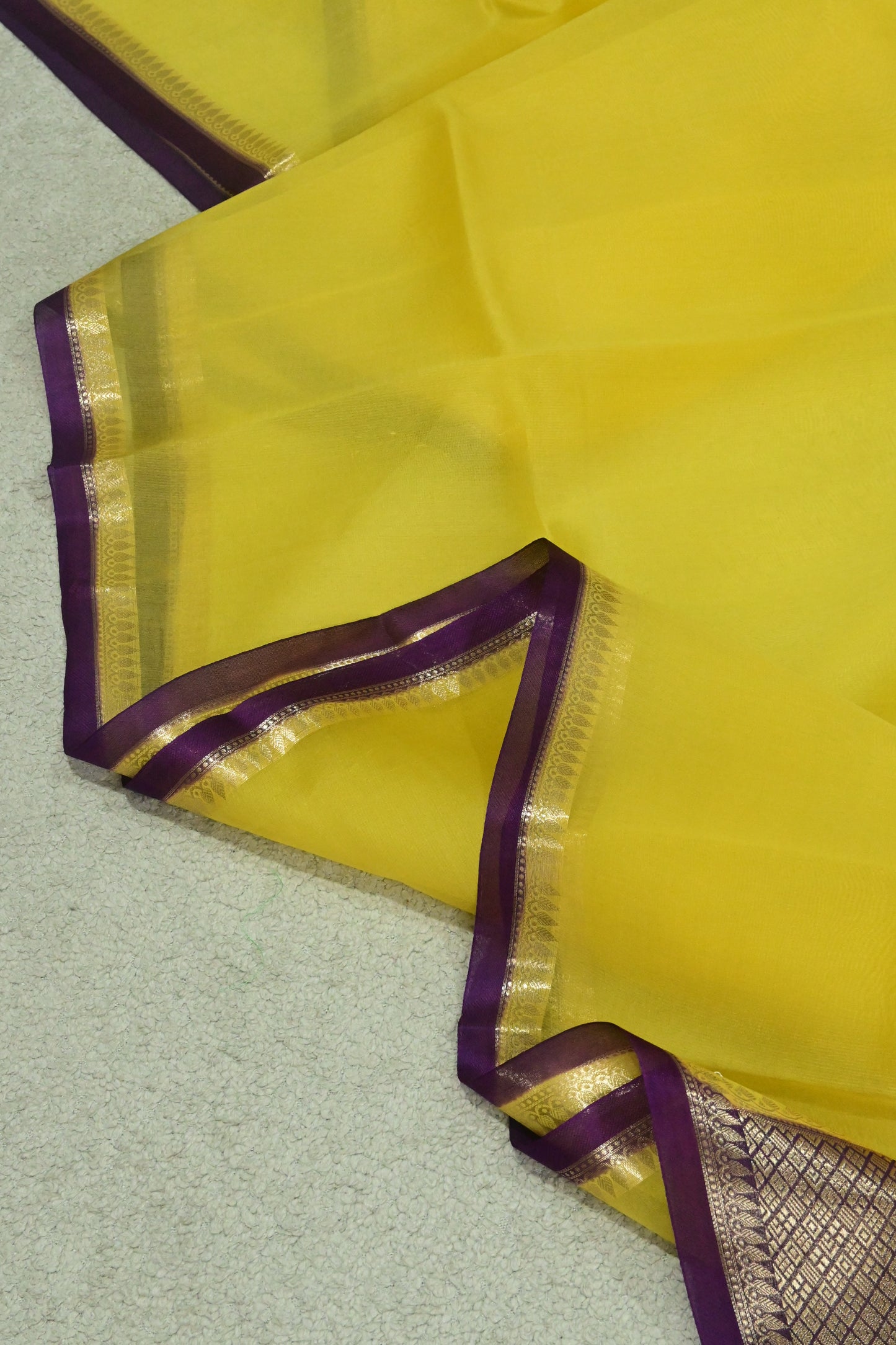 Handwoven pure Kora organza saree in contrast yellow with purple edge