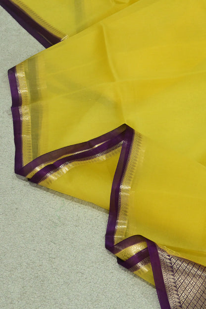 Handwoven pure Kora organza saree in contrast yellow with purple edge