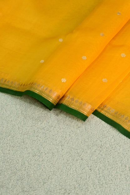 Classic yellow Kora Organza with a touch of emerald green.