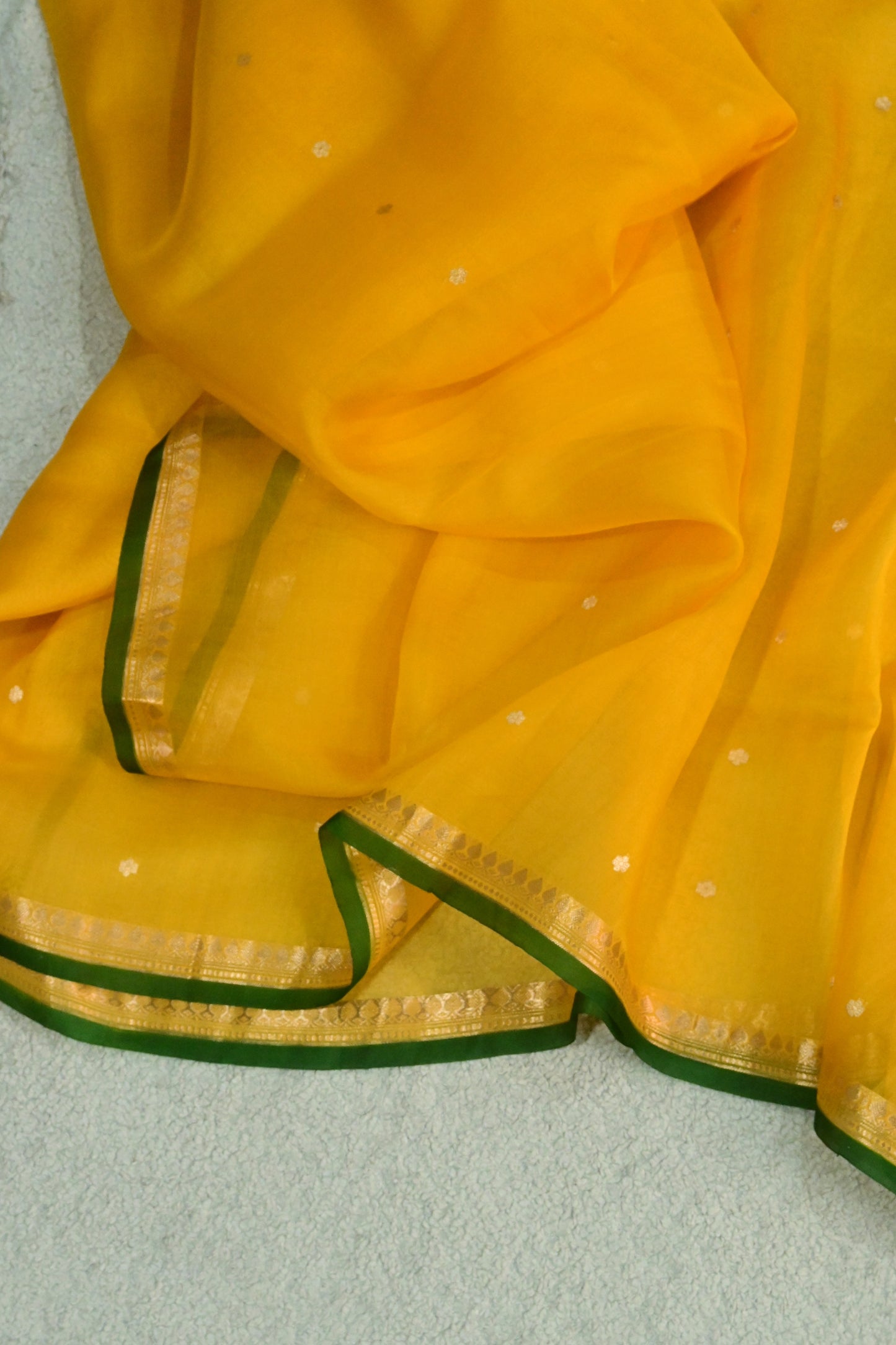Classic yellow Kora Organza with a touch of emerald green.