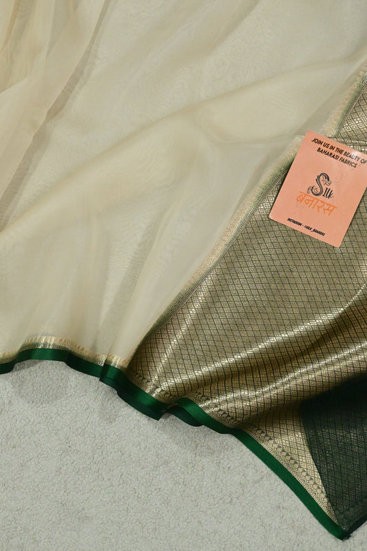 Handloom pure kora organza silk saree having satin bottlegreen selvage