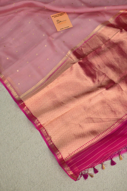 A lightweight pastel kora organza woven with timeless zari details.