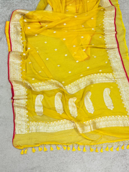 Handwoven Pure Khaddi Chiffon Banarasi Saree in Bright Yellow with Silver Zari & Contrast Red Piping