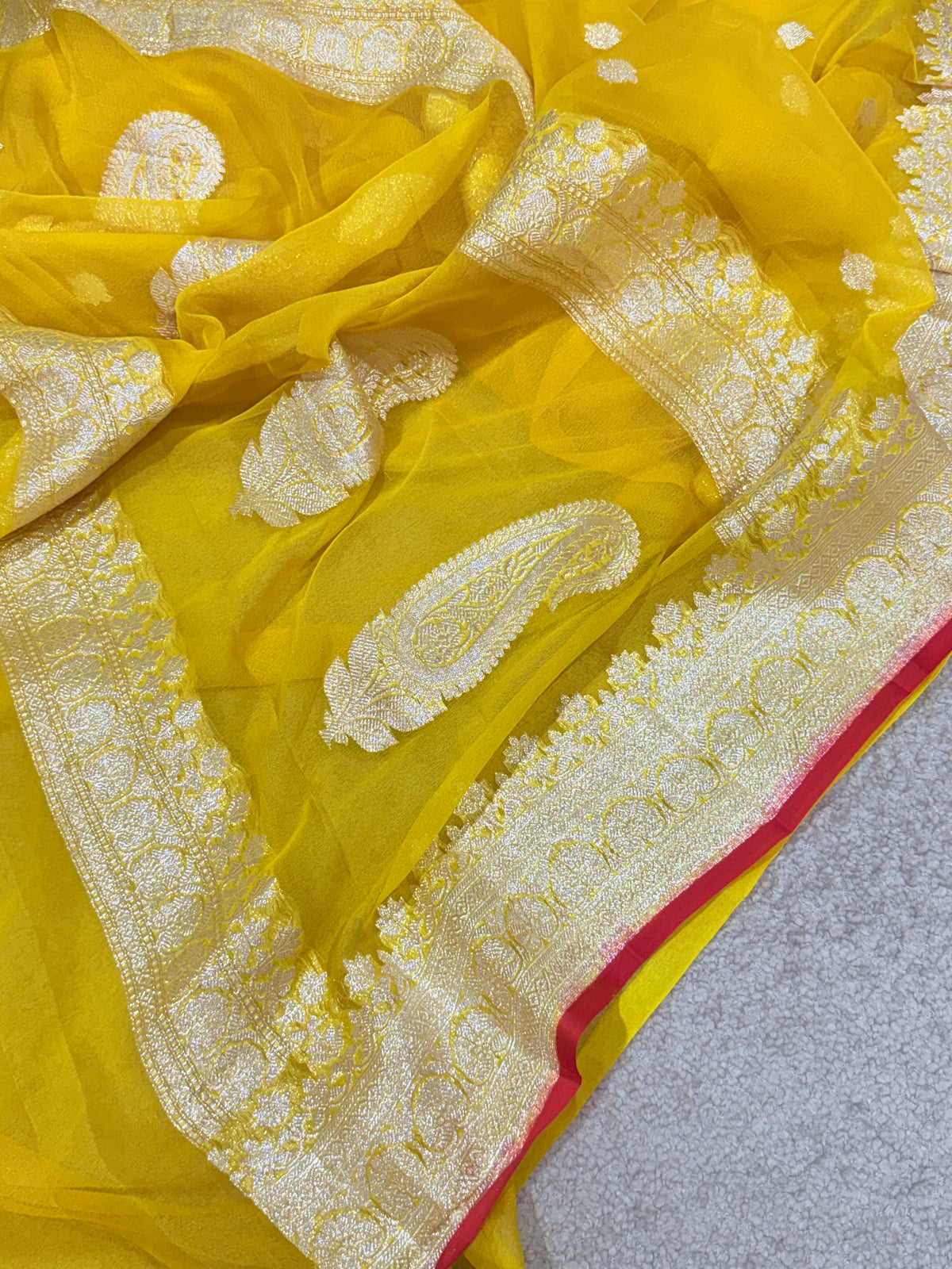 Handwoven Pure Khaddi Chiffon Banarasi Saree in Bright Yellow with Silver Zari & Contrast Red Piping