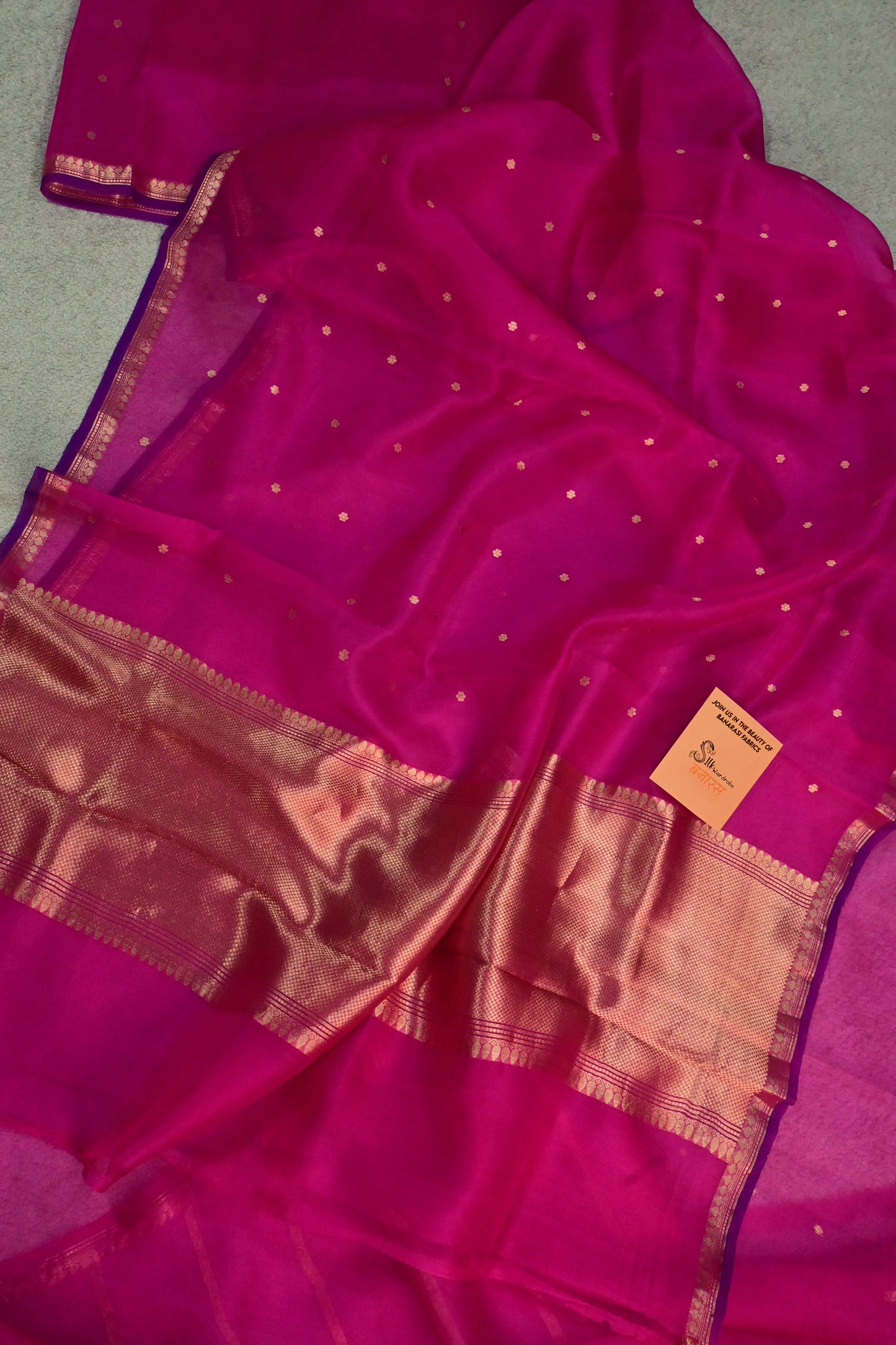 Pure Kora organza saree featuring delicate gold buttis and a contrast purple edge