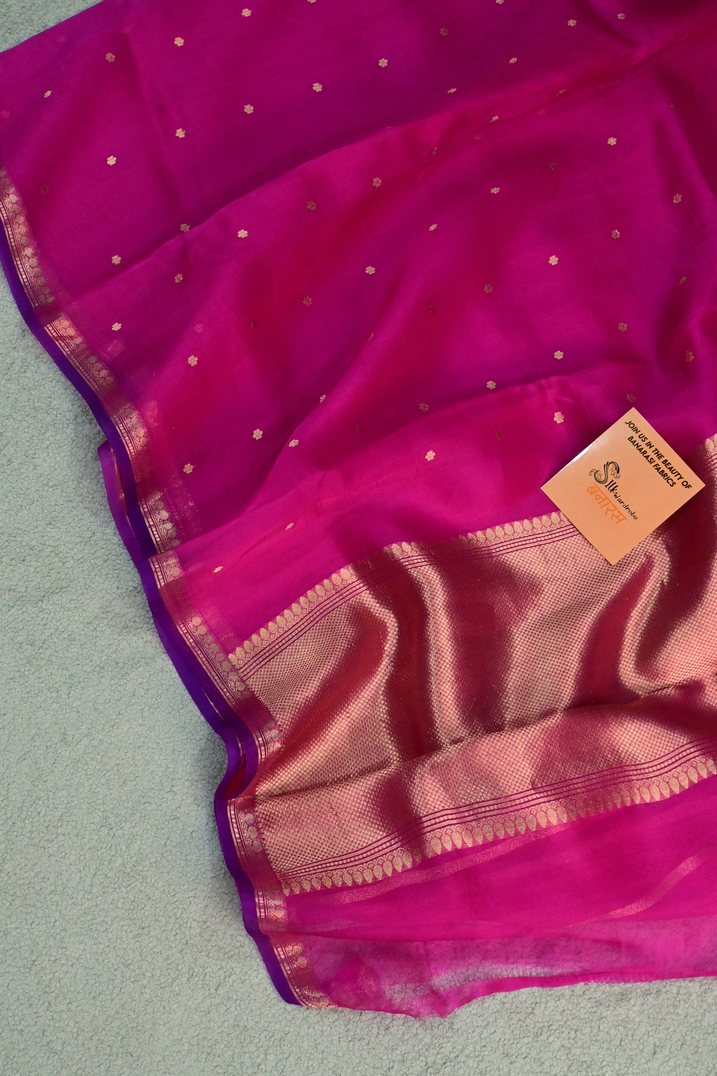 Pure Kora organza saree featuring delicate gold buttis and a contrast purple edge