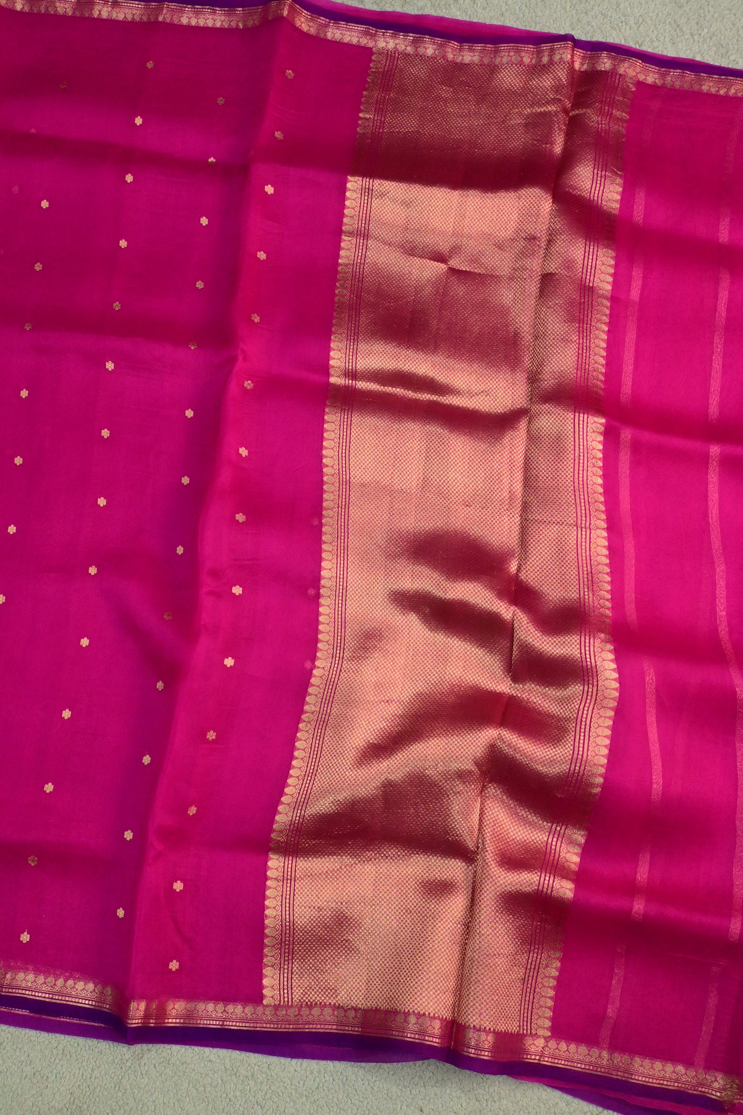 Pure Kora organza saree featuring delicate gold buttis and a contrast purple edge