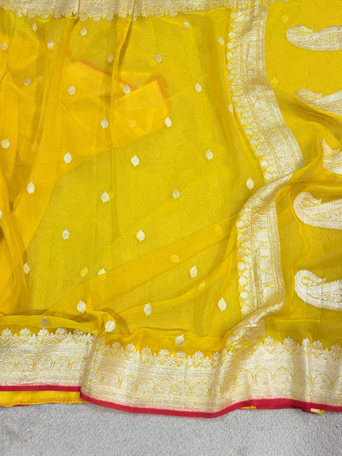 Handwoven Pure Khaddi Chiffon Banarasi Saree in Bright Yellow with Silver Zari & Contrast Red Piping