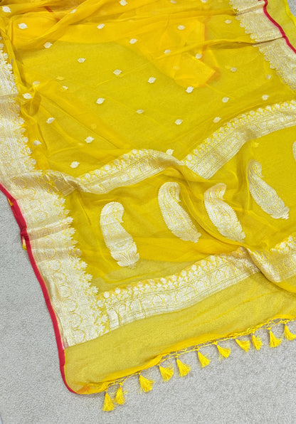 Handwoven Pure Khaddi Chiffon Banarasi Saree in Bright Yellow with Silver Zari & Contrast Red Piping