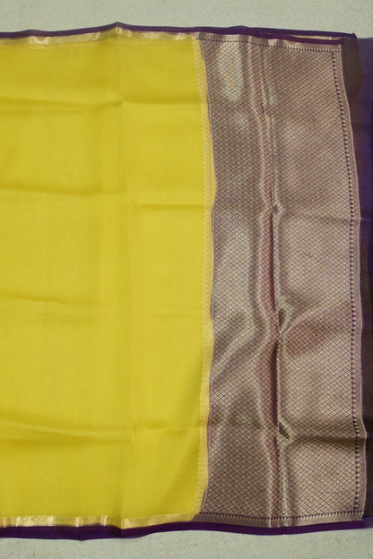 Handwoven pure Kora organza saree in contrast yellow with purple edge